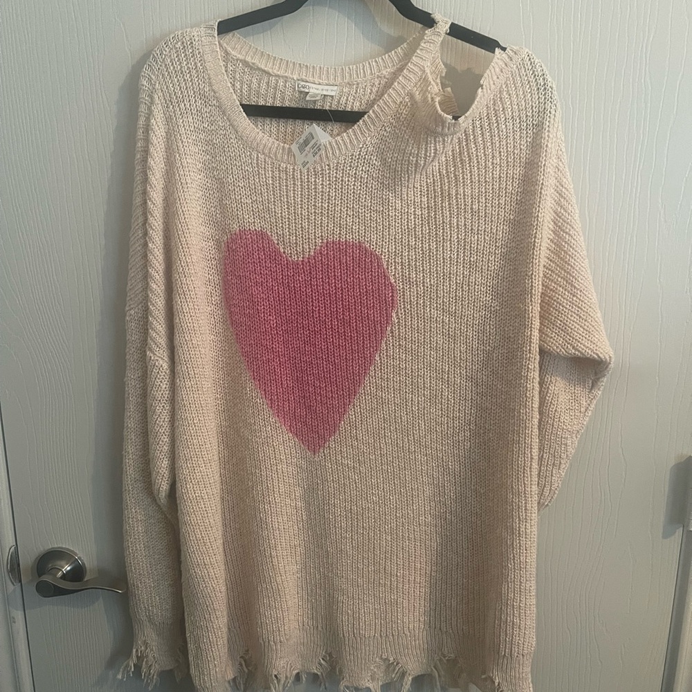 Sweetheart plus sized cold shoulder distressed sweater.